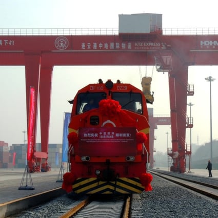 The first train runs on a new railway line linking China's Lianyungang and Kazakhstan's Almaty, a boost to the construction of the Silk Road Economic Belt. Photo: Xinhua