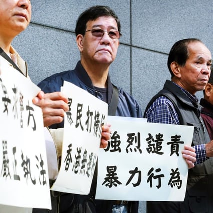 Unionists hand in a petition to Wan Chai police headquarters calling for protection of shop workers and tourists following anti-parallel trading protests that turned violent. Photo: Felix Wong