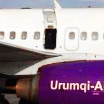 The door of China's Urumqi Airlines aircraft was opened just as the plane was preparing to take off on a domestic flight on Saturday. Photo: Yaxin.com