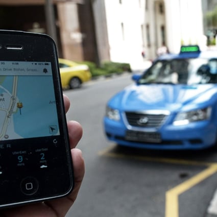 Ride-hailing app Uber (its app shown above) has failed to gain significant market share on mainland China since it debuted there last year so a merger could prove beneficial. Photo: AFP