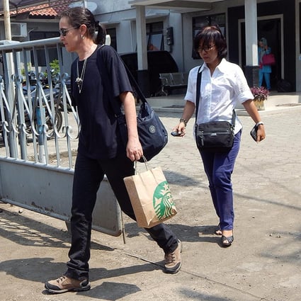 The cousin of Brazilian death row prisoner Rodrigo Gularte, leaves the outpost of Nusakambanga prison island, off central Java. An Indonesian court adjourned the latest legal bid by the two Australian drug smugglers, the ringleaders of the so-called "Bali Nine" drug trafficking gang. Photo: AFP