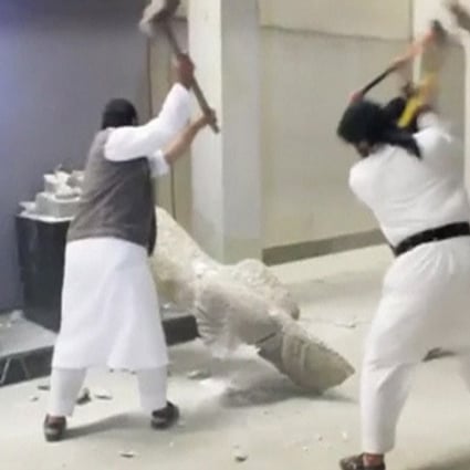 An Islamic State video shows men using sledgehammers on a toppled statue in a museum said to be in Mosul.