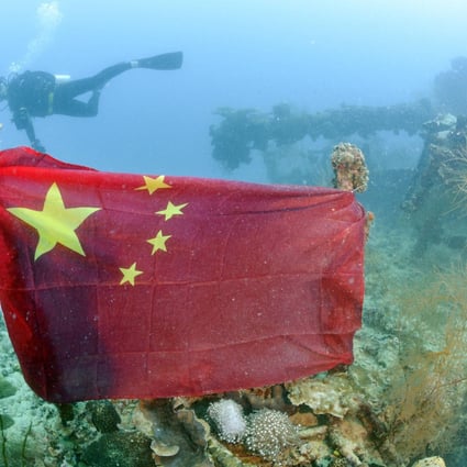 A Chinese national flag tied to the wreckage of the Iro, an oil tanker for the Imperial Japanese Navy. Photo: Kyodo