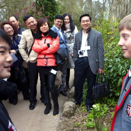 Parents from China, looking for a private education for their children in the UK, look around Kingswood school in Bath and meet the head boy of the prep school. Photo: China Foto Press