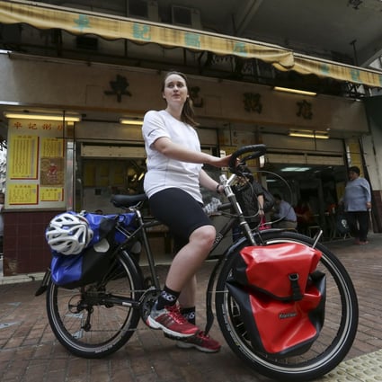 Julia Mason cycles through Kennedy Town, Hong Kong. Photo: Jonathan Wong
