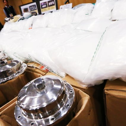 Customs officers with a 104kg haul of Ice seized at Chek Lap Kok in December last year. Photo: Felix Wong