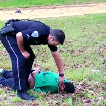 City patrolman Michael Thomas Slager checks Walter Scott's pulse after the shooting, in a frame from a video provided by the Scott family's attorney. Photo: AP