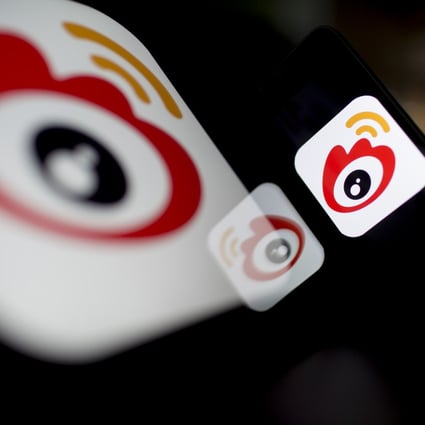 The logo of Sina Corp.'s Sina Weibo microblog service is displayed on an Apple iPad and iPhone. Photo: Bloomberg
