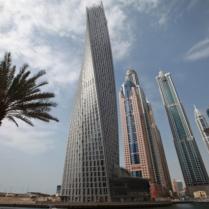 Cayan built the landmark 307-metre twisted skyscraper in Dubai Marina. Photo: EPA