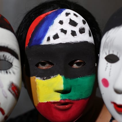 Masks painted by an asylum seeker were displayed at an exhibition on asylum seekers in Hong Kong last year. Photo: Nora Tam