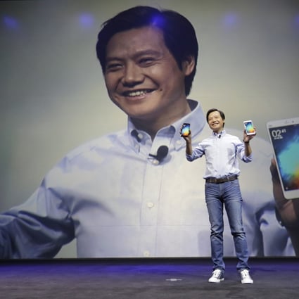 Xiaomi co-founder Lei Jun presents a new phone "Apple style", but the company eschews the big spending on marketing of its US rival. Photo: Reuters. 