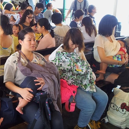 Women breastfeed on a ferry yesterday. Photo: SCMP Pictures
