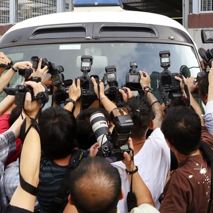 Zheng Xingwang, who was arrested when he tried to leave Hong Kong on Sunday, leaves Kwun Tong Court yesterday. Photo: Sam Tsang