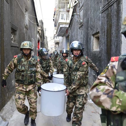 Paramilitary police pictured in December during raids on methamphetamine factories in Guangdong province. Three tonnes of the drug were found in one village. Photo: Reuters