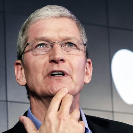 Apple CEO Tim Cook responds to a question during a news conference. Photo: Reuters