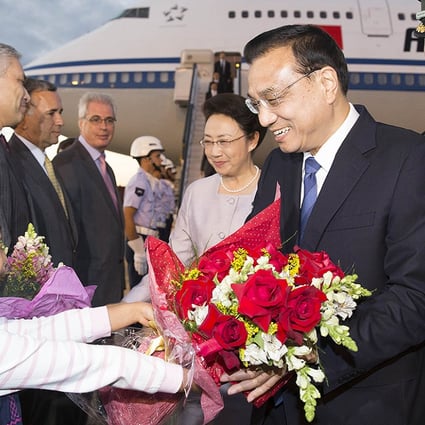 Chinese Premier Li Keqiang and his wife Cheng Hong arrive in Brasilia. Photo: Xinhua