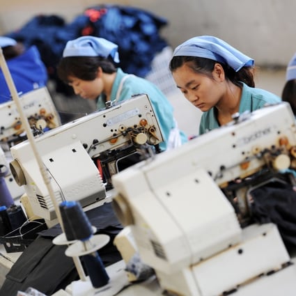 Workers produce clothes in a factory in China's Anhui province. Photo: AFP