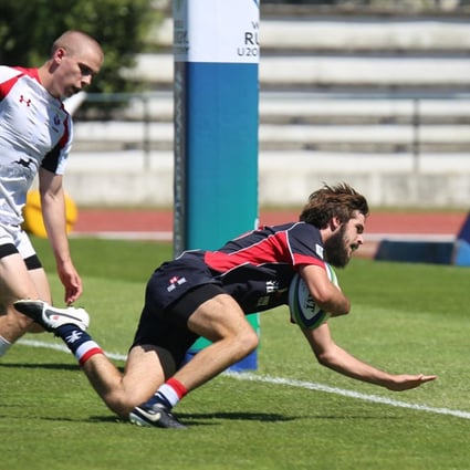 Hong Kong’s Liam Owens gets across the line against Canada during their pool encounter at the World Rugby Under 20 Trophy in Portugal. Photos: World Rugby