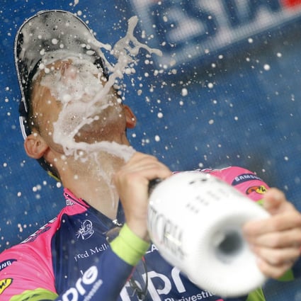 Italian rider Sacha Modolo (Lampre Merida) celebrates on the podium after winning the 13th stage of the 98th Giro d'Italia.  Photo: AFP