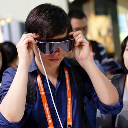 A man tries out 3D goggles during the 2015 International Consumer Electronics Show Asia in Shanghai. Photo: Reuters