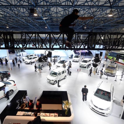 Vehicles are displayed at the 18th China Beijing International High-Tech Expo in the Chinese capital in May. Analysts say the government needs to create a level playing field to allow all types of businesses to flourish. Photo: AFP