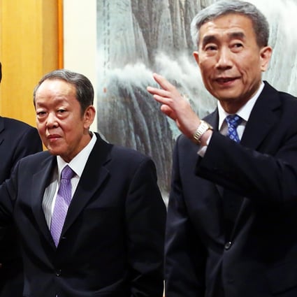 Beijing officials Zhang Xiaoming, Wang Guangya and Li Fei speak to the media after yesterday's meeting. Photo: Sam Tsang