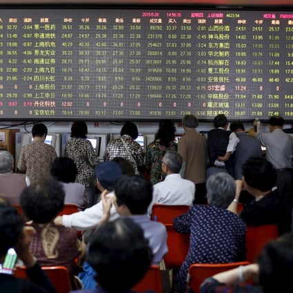 Investors in Shanghai monitor stock prices as punters piled in on surging share values as the fear of missing out on the next big thing spurred buying in Chinese markets. Photo: Reuters