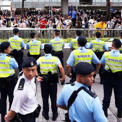 Police officers stand guard outside the Legco complex. Photo: Felix Wong