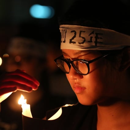 A secondary school student joins last year's vigil in Victoria Park. Photo: Nora Tam