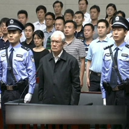 A white-haired Zhou Yongkang, China's former domestic security tsar, stands in court in Tianjin as he is sentenced on Thursday. Photo: Reuters