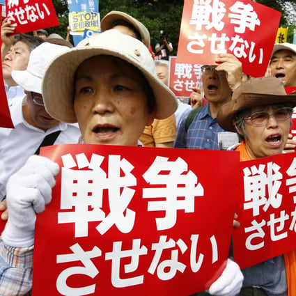 About 25,000 protesters gather outside the parliament building in Tokyo to oppose a set of controversial bills intended to expand Japan’s defense role. Photo: AP