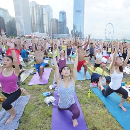 Om Together: more than 600 participants came together to stretch and sweat throughout the 90 minute yoga practice during the Green Summer Festival at Central Harbourfront Event Space in September 2014. Photo: Stretch City