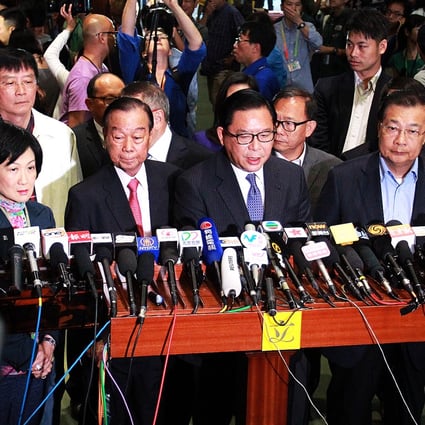 Pro-Beijing legislators Ip Kwok-him, Starry Lee, Regina Ip, Lau Wong-fat, Jeffrey Lam, and Tam Yiu-chung meet the press after the reform package was rejected on Thursday. Photo: May Tse