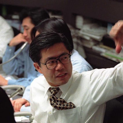 A foreign currency trader flashes the thumbs down, with the Chinese yuan strengthening in the onshore spot market as worries over Greek default eased. Photo: AFP