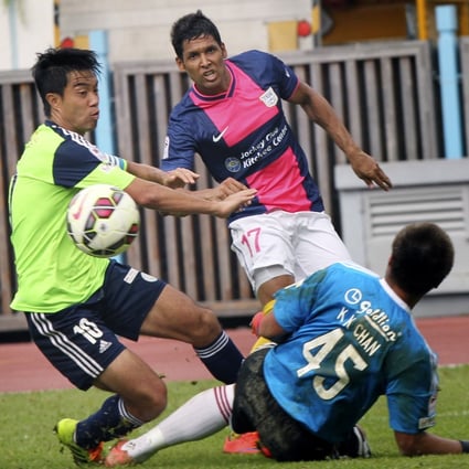 Wofoo Taipo's Lui Chi-hing (left) and Kitchee's Paulo Carreiro in action during a Hong Kong Premier League match on May 2. Photo: May Tse