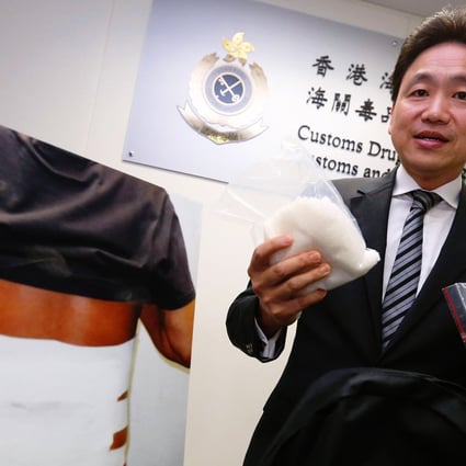 Customs assistant commissioner Albert Ho demonstrates methods of smuggling crystal meth across the border. Photo: Nora Tam