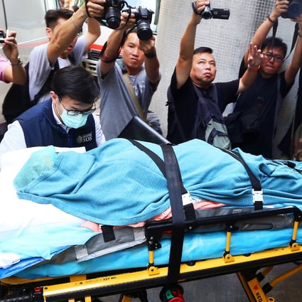 A woman who suffered burns in a dust explosion in Taiwan arrives at Queen Mary Hospital. Photo: Sam Tsang
