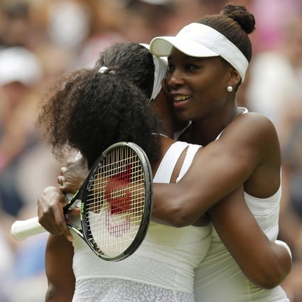 The Williams sisters give each other a big hug after Serena easily overcame sibling Venus to reach the quarter-finals, firing 10 aces in their match. Photo: Reuters