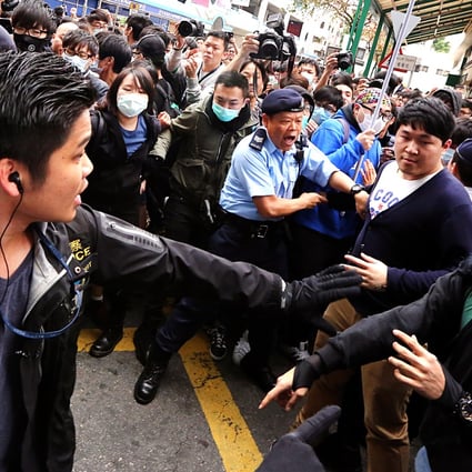 Police clash with localist groups during an anti-parallel goods trading protest in Yuen Long on March 1. A 17-year-old schoolboy accused of hitting a policeman with a restaurant door amid the chaos has been acquitted by a court. Photo: Felix Wong