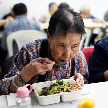 Elderly residents enjoy the nourishing results at one of the programme’s centres. Photo: SCMP pictures