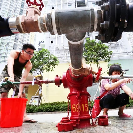 Residents of Kai Ching Estate use a temporary tap. Photo: Felix Wong