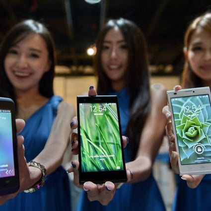 Models show off ZTE smartphones. The company is working with China Mobile to bring faster 'pre-5G' mobile internet to Chinese mobile phone users. Photo: AFP