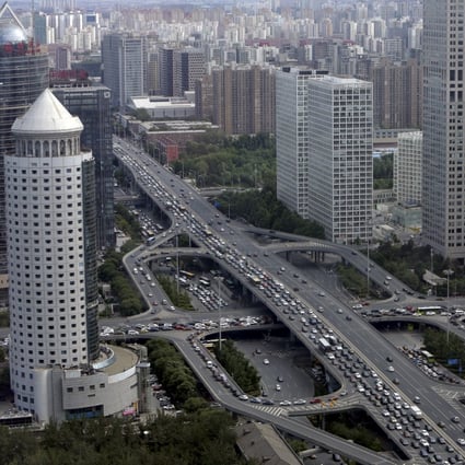 State-owned enterprises outside Beijing will be strictly prohibited from moving their headquarters to the capital under a blueprint to cap population in the city. Photo: Reuters