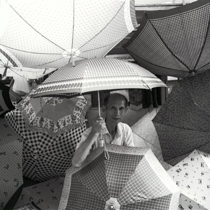 Ho Hung-hee surrounded by his beloved umbrellas at his repair stall in Central that he operated for over half a century.Photo: SMP Pictures