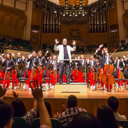 The National Youth Orchestra of the United States of America and conductor Charles Dutoit bask in the applause of the Cultural Centre audience. Photo: Chris Lee