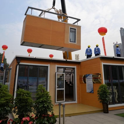A villa being assembled at a green modular housing show. Photo: ImagineChina