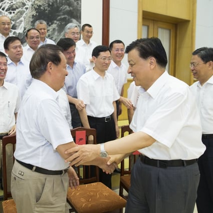 Liu Yunshan, China's Politburo Standing Committee member and Secretariat head, meets scientists and experts who are enjoying a state-sponsored summer vacation at popular seaside resort Beidaihe in Hebei province. Photo: Xinhua