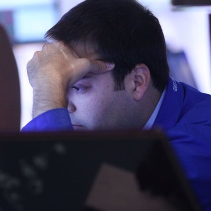 A worried investor on Wall Street stares at his screen as investors brace for likely US interest rate increases as soon as next month. Photo: AFP