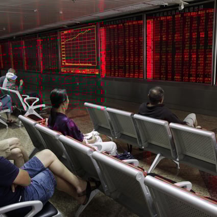 Investors in China's stock markets stare at an electronic board on stock prices as ADRs listed in the US face a complicated task to relist in markets in Shanghai and Shenzhen. Photo: EPA