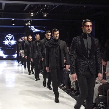 Male models on the catwalk at this year's Tehran Fashion Week.